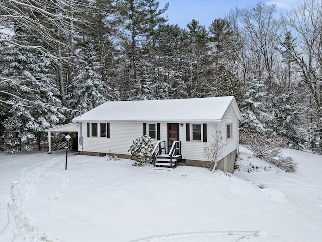 view of front of home featuring a carport