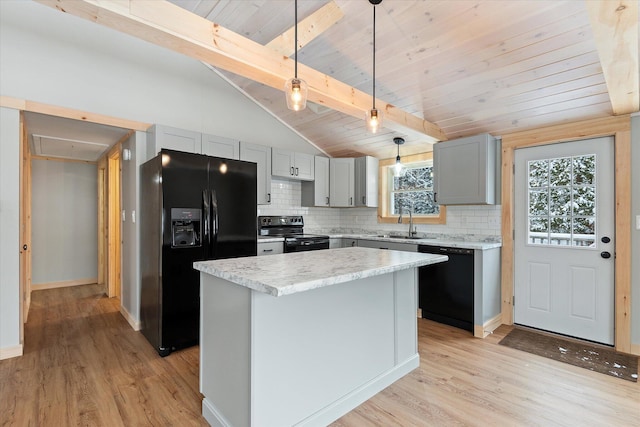 kitchen with gray cabinetry, hanging light fixtures, decorative backsplash, a kitchen island, and black appliances