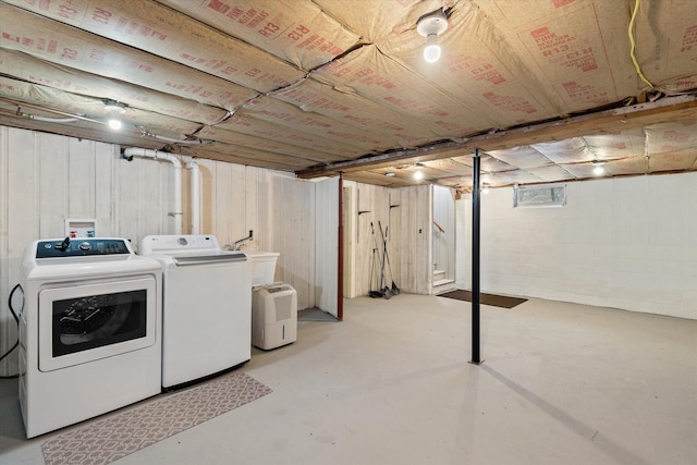 clothes washing area featuring washer and dryer