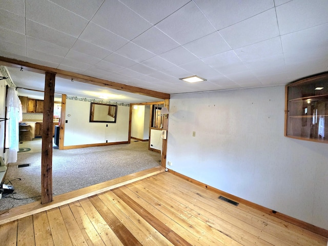 basement featuring hardwood / wood-style floors