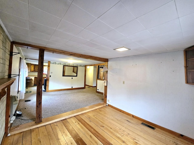 basement with hardwood / wood-style floors