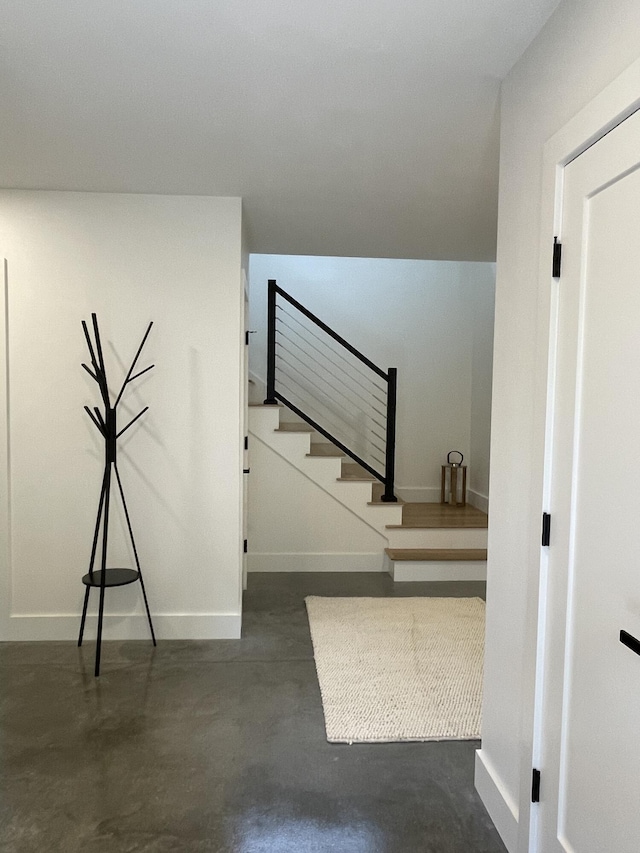 stairs with concrete floors