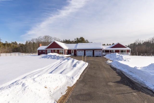 ranch-style home featuring a garage