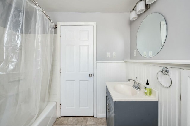 bathroom featuring vanity and shower / bath combination with curtain