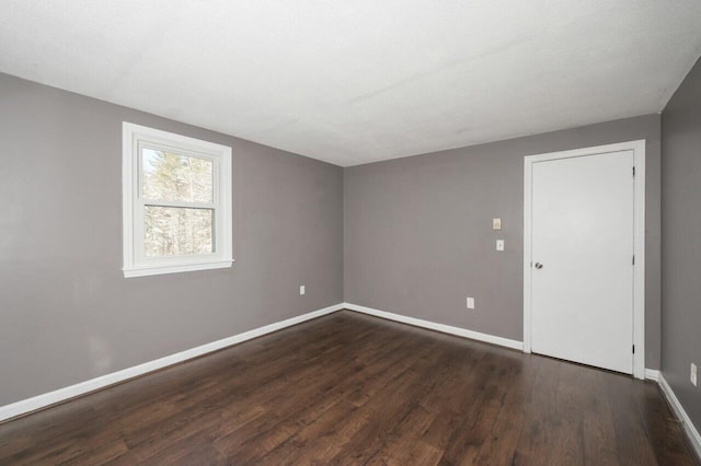 empty room featuring dark hardwood / wood-style floors