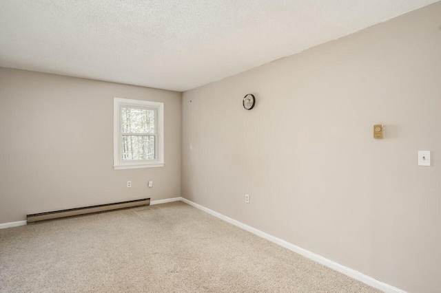 empty room with carpet floors, baseboard heating, and a textured ceiling