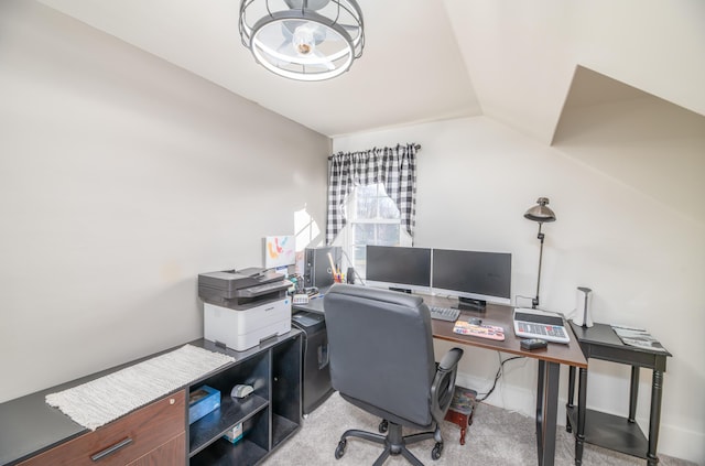 carpeted office with vaulted ceiling