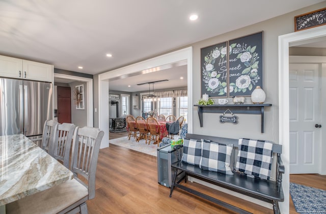 dining space with light hardwood / wood-style floors