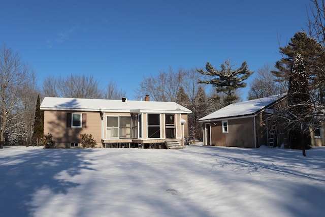 view of front of property featuring a sunroom