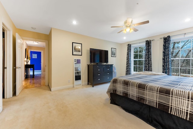 carpeted bedroom with ceiling fan