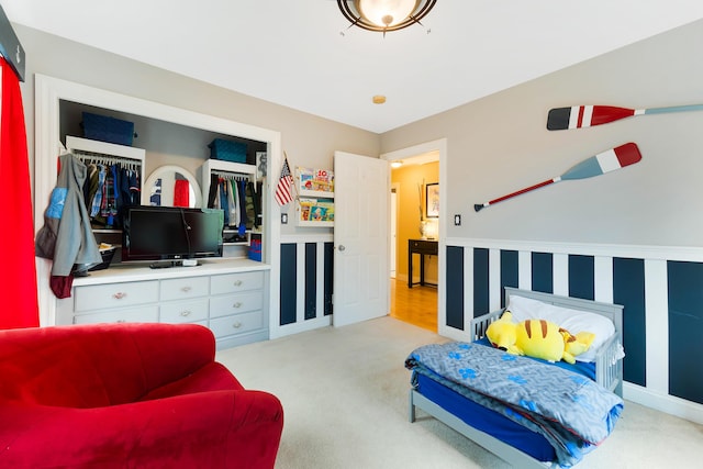 carpeted bedroom featuring a closet