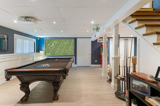 rec room with a drop ceiling, light hardwood / wood-style floors, and billiards