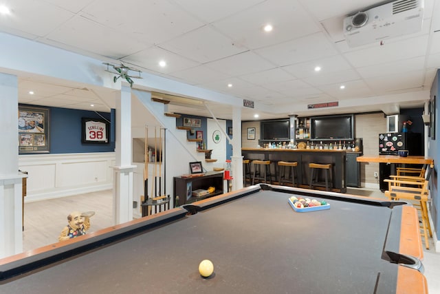 recreation room with bar area, a drop ceiling, and billiards