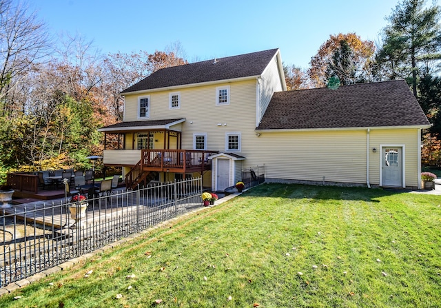 rear view of property with an outdoor hangout area, a patio area, a yard, a storage shed, and a deck