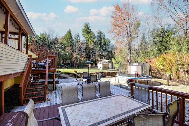 wooden terrace featuring a trampoline