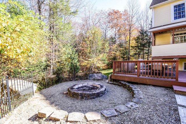 view of yard featuring a fire pit and a deck