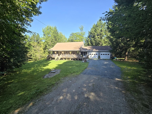 view of front of home featuring a front yard and a garage