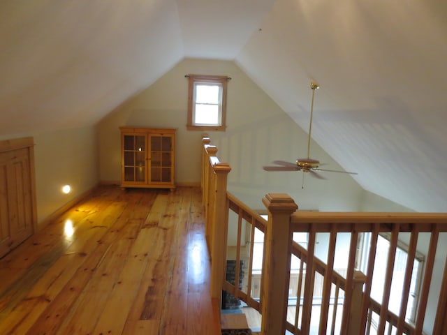 bonus room featuring ceiling fan, light hardwood / wood-style floors, and vaulted ceiling