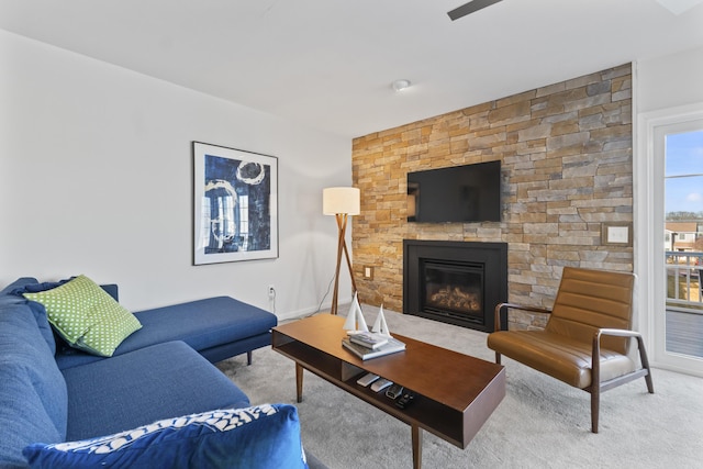 living room featuring a fireplace and carpet flooring