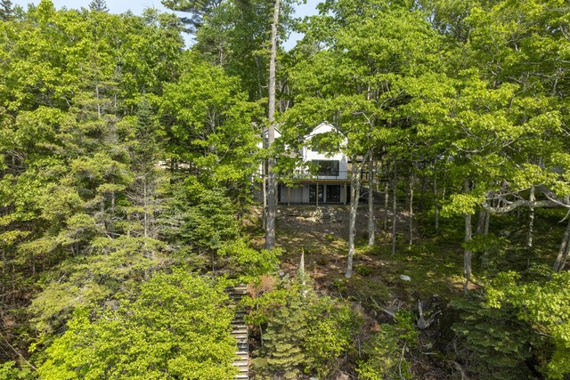 31 Viking Way, Bristol, ME 04539 - exterior space with stairway, a wooden deck, and a wooded view