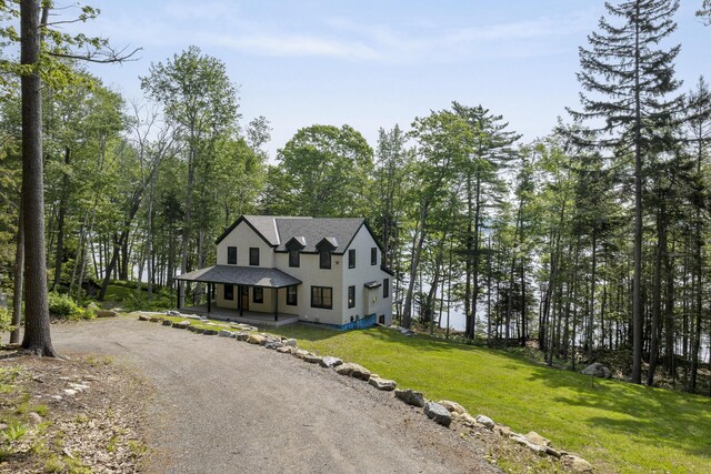31 Viking Way, Bristol, ME 04539 - view of front of property featuring covered porch, dirt driveway, and a front yard