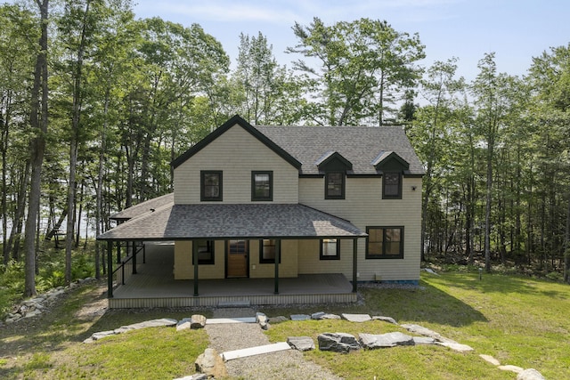 31 Viking Way, Bristol, ME 04539 - view of front of home featuring roof with shingles, a front yard, and covered porch