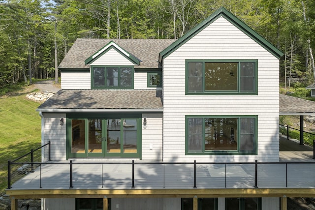 31 Viking Way, Bristol, ME 04539 - view of front of house featuring a shingled roof, a wooden deck, and a front yard
