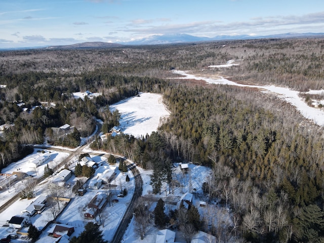 snowy aerial view with a mountain view