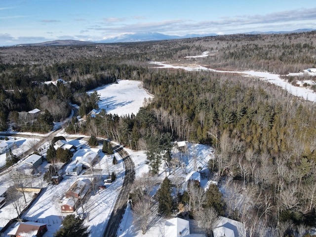 snowy aerial view with a mountain view