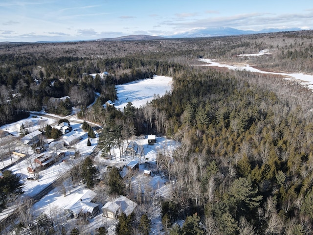 snowy aerial view with a mountain view