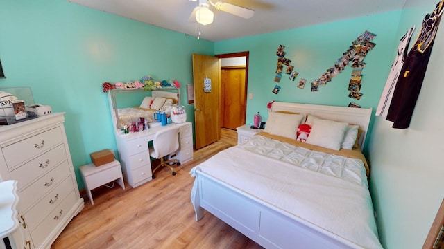 bedroom with ceiling fan and light hardwood / wood-style floors