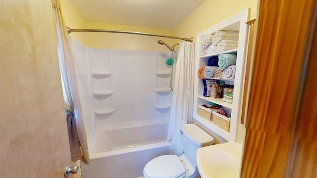 bathroom with shower / bath combo with shower curtain and toilet