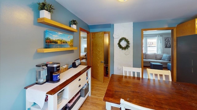 dining area with light hardwood / wood-style floors