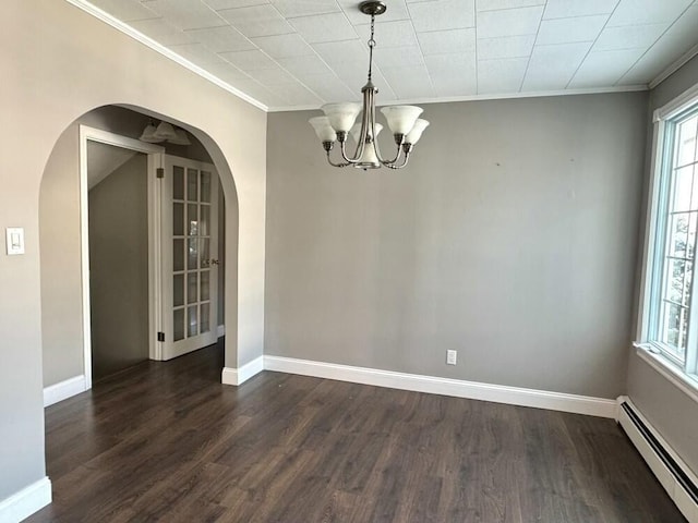 unfurnished dining area with dark wood-type flooring, a baseboard radiator, crown molding, and a chandelier