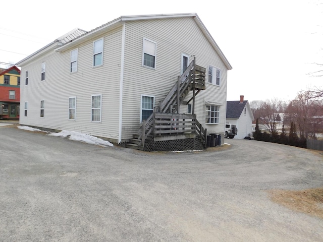 view of property exterior with cooling unit