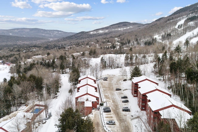 snowy aerial view featuring a mountain view