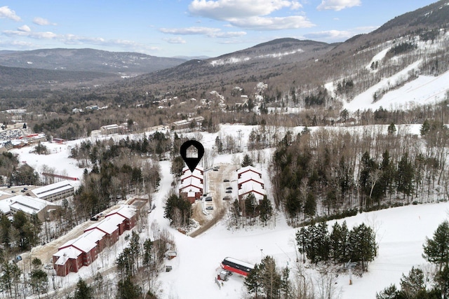 snowy aerial view with a mountain view