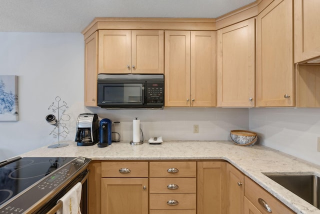 kitchen with range with electric cooktop, light brown cabinets, sink, light stone counters, and a textured ceiling