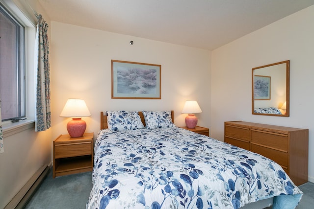 carpeted bedroom featuring a baseboard radiator