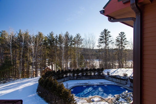 view of snow covered pool