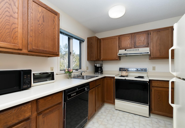 kitchen featuring sink and black appliances