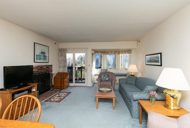 carpeted living room featuring a fireplace