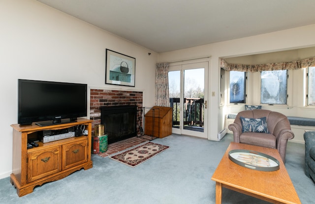 carpeted living room featuring a fireplace