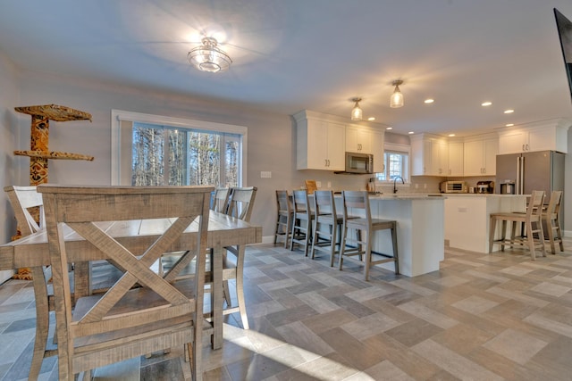 dining area featuring sink