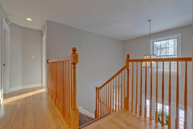 stairs featuring wood-type flooring