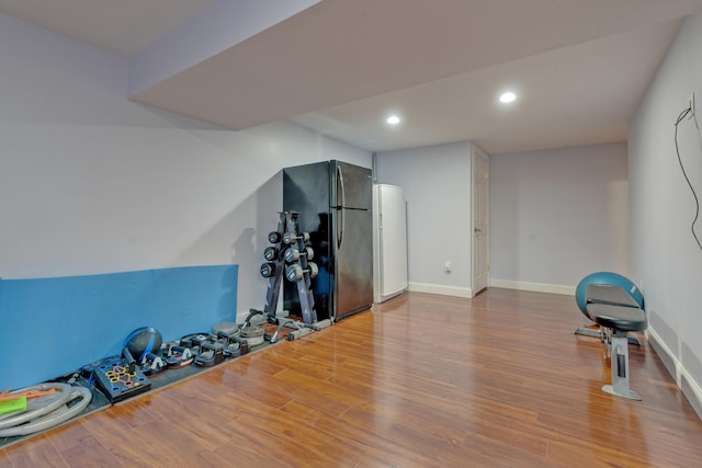 workout room with hardwood / wood-style floors