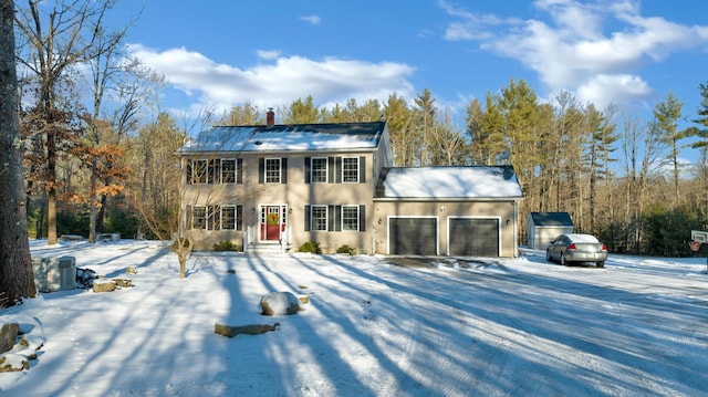 view of front of house featuring a garage and central air condition unit