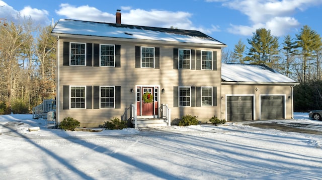 colonial house featuring a garage