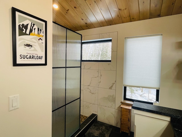 bathroom featuring wooden ceiling, tile walls, and plenty of natural light