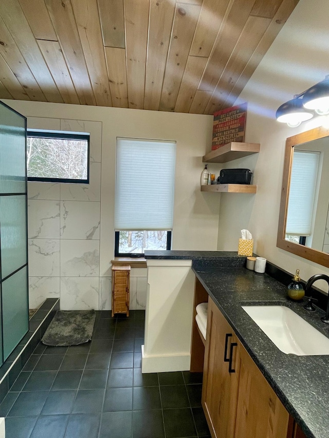 bathroom with a healthy amount of sunlight, wood ceiling, tile walls, and vanity